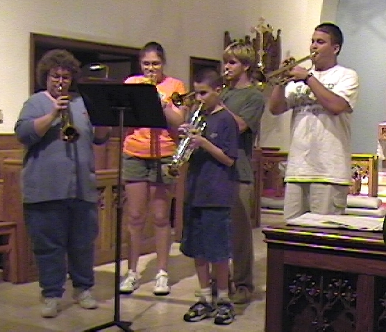 five trumpet players playing a quartet written by yours truly